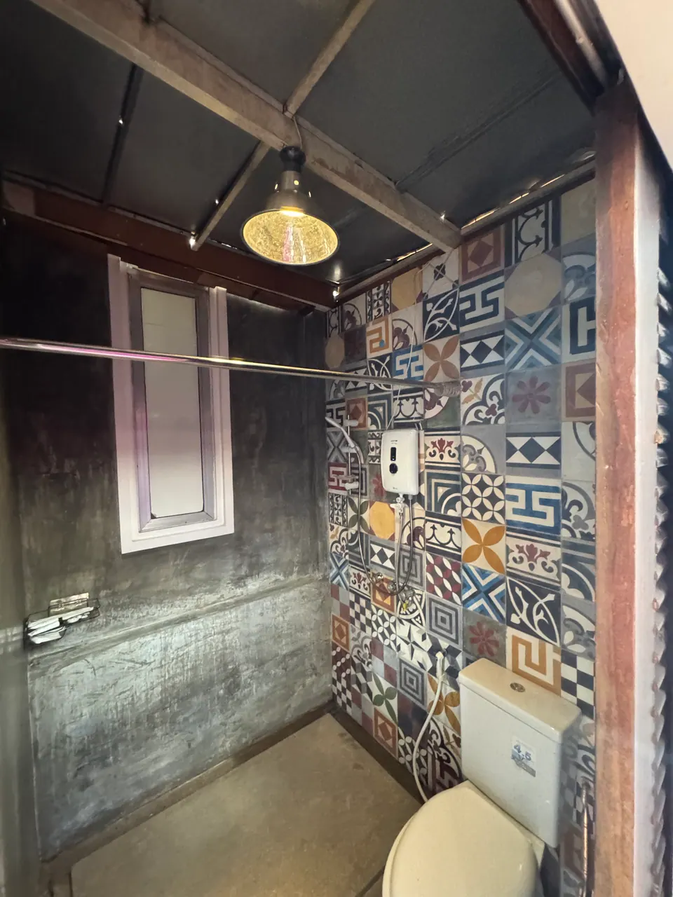 Shower with hand-painted cement tiles